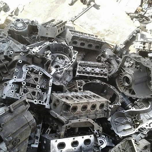 A heap of alluminuim engine blocks with other spare part scraps