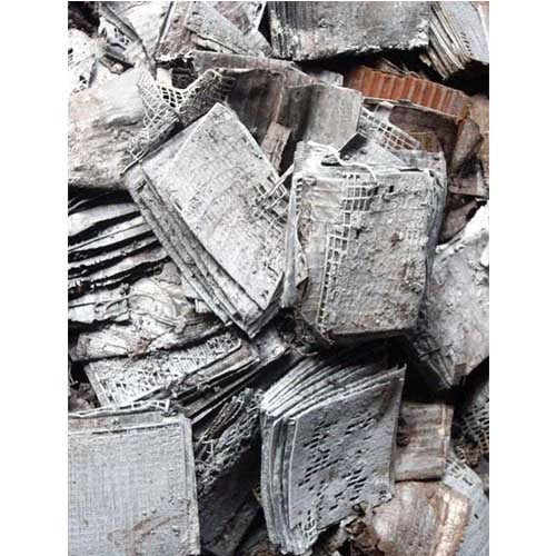 A pile of lead battery plates scrap waiting for further recycling.